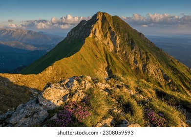 Beautiful mountains during the spring season with fresh green grass, beautiful skies and deep valleys. Vysoke Tatry, Slovakia, High Tatras