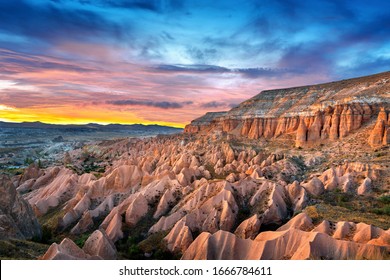 Beautiful mountains and Red valley  at sunset in Goreme, Cappadocia in Turkey.