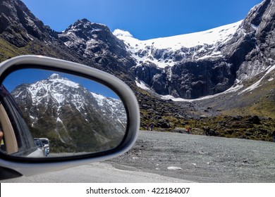 Beautiful mountains seen on the rearview mirror.
Road to Milford Sound in New Zealand
 - Powered by Shutterstock