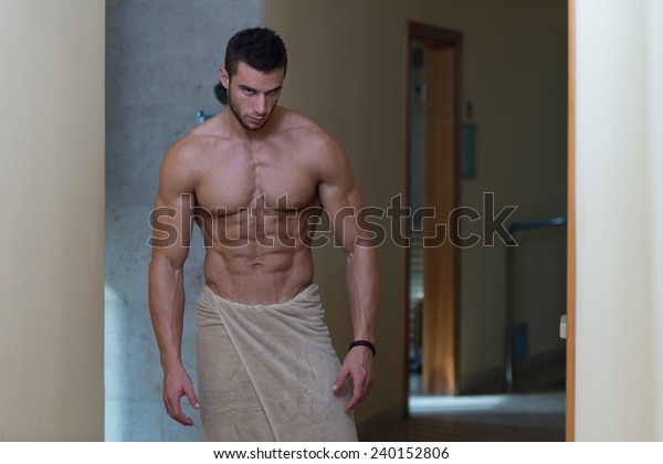 beautiful-muscular-man-towel-after-600w-240152806.jpg