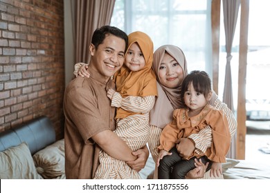 Beautiful Muslim Family Smiling To Camera. Ramadan Concept At Home