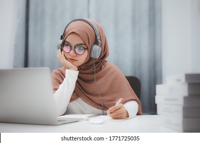 Beautiful Muslim Student Girl Using A Laptop Computer Learning Online At Home. Distance Learning Online Education.