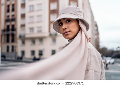 Beautiful muslim woman wearing head scarf posing and looking at camera in the street. - Powered by Shutterstock