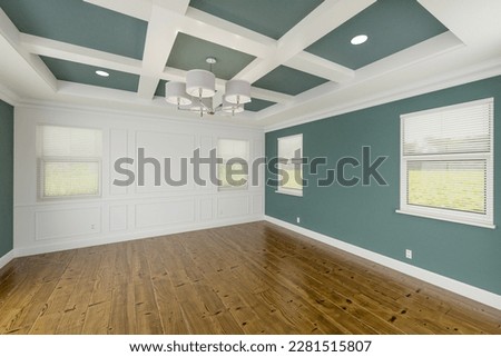 Beautiful Muted Teal Custom Master Bedroom Complete with Entire Wainscoting Wall, Fresh Paint, Crown and Base Molding, Hard Wood Floors and Coffered Ceiling