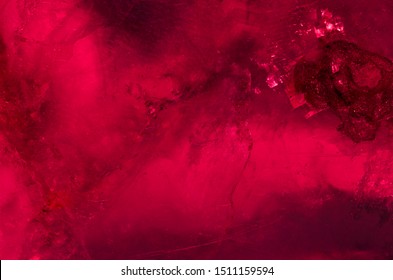 The beautiful mysterious dark red ruby texture background of the crystal of mineral.