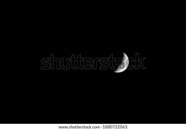 beautiful\
mystic crescent moon on dark night background with copy space. in a\
clear black sky shines a rising crescent moon.\
