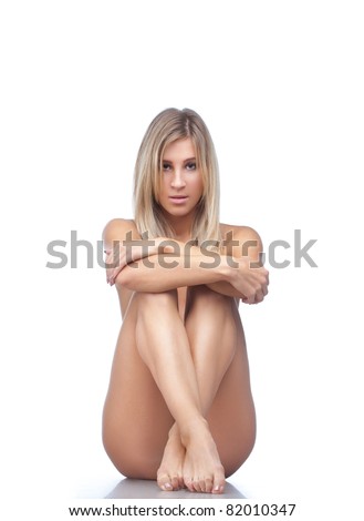 Beautiful Naked Blonde Woman Sitting On The Floor Isolated Over White Beautiful Naked Blonde Woman Sitting On The Floor Isolated Over White