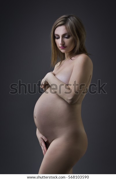 400px x 620px - Beautiful Naked Pregnant Woman Navel Piercing Stock Photo ...