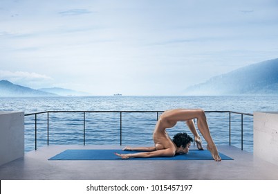 Beautiful Naked Woman Practicing Yoga Poses On Nature Outdoors