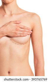 Beautiful naked young woman covering her breast with sketches under it, isolated on a white background, cropped