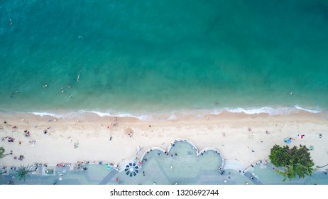 Beautiful natural aerial view of Pattaya Beach with turquoise seawater and white fluffy bubble from wave which is rolling to white sand beach. - Shutterstock ID 1320692744