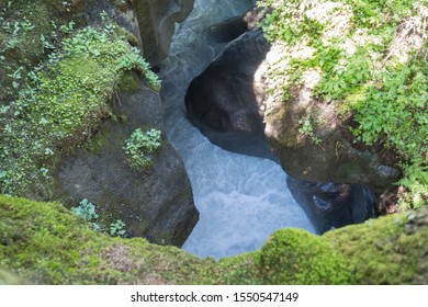 Beautiful natural ravine with the rapid stream waters on the Tour de Mont-Blanc trail in Auvergne-Rhône-Alpes, France