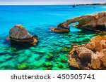 Beautiful natural rock arch near of Ayia Napa, Cavo Greco and Protaras on Cyprus island, Mediterranean Sea. Legendary bridge lovers. Amazing blue green sea and sunny day.