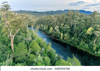 Beautiful Natural Scenery Of River In Tahune Forest, Tasmania, Australia.  Tropical Green Forest With Mountains In Background, Aerial View Drone Shot