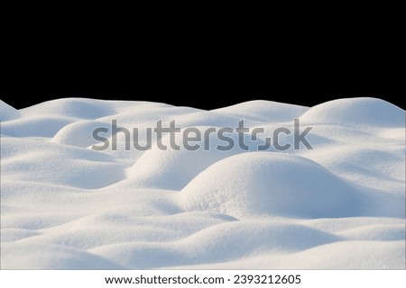Beautiful natural Snowdrift isolated on black background. Nature Winter background of snow on sunny day. Design element. Winter snowy Texture With Copy Space. Template for design