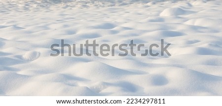Beautiful natural Snowdrift in sunny day. Nature Winter snow background, selective focus. Winter snowy Texture With Copy Space for design