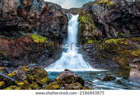Beautiful natural waterfall. Foliage in beautiful natural waterfall