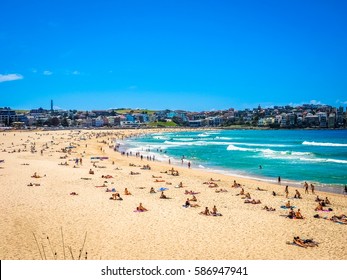 Beautiful Nature Of Bondi Beach In Sydney, Australia. People Enjoy Swimming, Surfing, And Sunbathing.