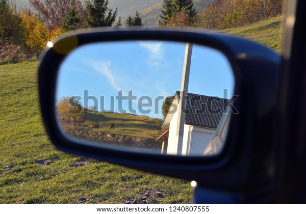 Beautiful nature of the Carpathians in the mirror of
the car.