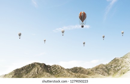 Beautiful nature landscape with flying balloons among high mountains and cloudly skyscape. 3D rendering.