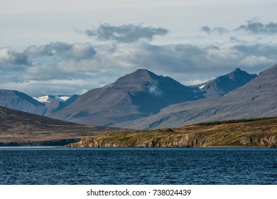 Beautiful Nature Landscape Including The Mountain Range, Sea, Waterfalls At The Countryside Of Island. Hauganes Is Located In Eyjafjörður, The Longest Fjord In Central Northern Iceland.