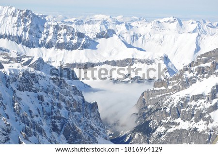 Beautiful nature landscape of Swiss Alps. Mountains covered with snow in Switzerland. Great view of the snowy rocks in Alpine ski resort Zermatt near Matterhorn mountain. Winter holidays background.