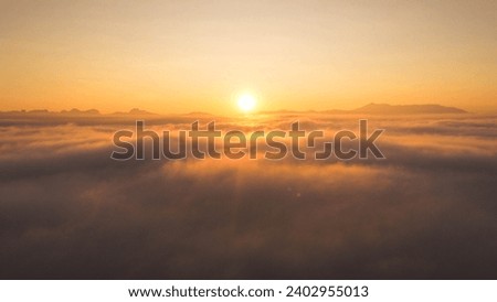 Beautiful nature morning with orange, yellow sunshine and fluffy clouds. Beautiful colorful dramatic sky with clouds at sunset or sunrise.