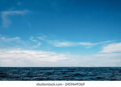 Beautiful nature view bright blue sky with white clouds background and soft oceans waves with a deep blue color on the sea - Powered by Shutterstock