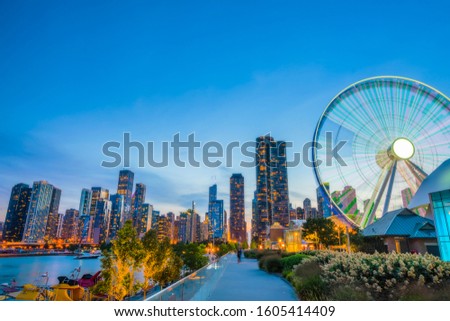beautiful Navy pier at dusk with chicago skyline.