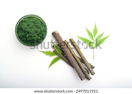 BEAUTIFUL NEEM PASTE WITH NEEM LEAF ISOLATED ON WHITE BACKGROUND.