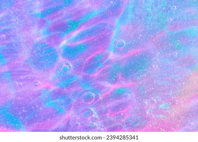 Beautiful neon purple, pink and blue transparent space alien glitter slime background texture. Sparkle cosmic, surreal abstract backdrop, ethereal, liquid art gel galaxy substance.