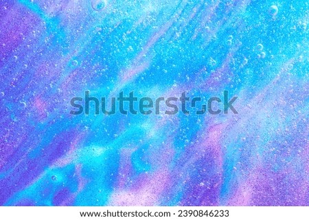 Beautiful neon purple, pink and blue transparent space alien glitter slime background texture. Sparkle cosmic, surreal abstract backdrop, ethereal, liquid art gel galaxy substance.