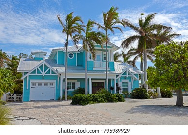 Beautiful New Florida House with Palm Trees and Landscaping Near the Beach. Would Make a Great Vacation Rental Property.