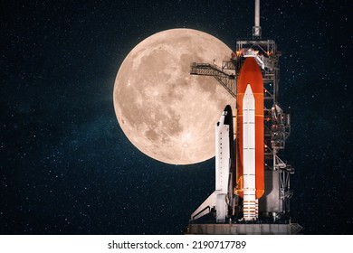 Beautiful new space shuttle prepares for launch against the backdrop of an amazing full moon in the starry sky. Space mission, concept.  - Powered by Shutterstock
