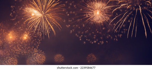 Beautiful New Year Holidays Background. Wonderful Golden Salute Over Dark Night Sky. Happy Christmas Time with Fireworks. Abstract Golden Lights - Powered by Shutterstock