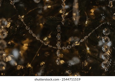 beautiful new year's toys, festive mood, selective focus, against the backdrop of bokeh from the lights of the garland. glass Christmas toys and glass icicles
