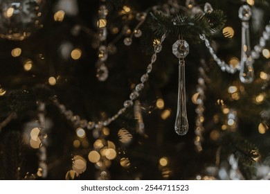 beautiful new year's toys, festive mood, selective focus, against the backdrop of bokeh from the lights of the garland. glass Christmas toys and glass icicles