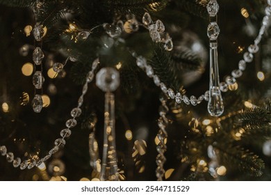 beautiful new year's toys, festive mood, selective focus, against the backdrop of bokeh from the lights of the garland. glass Christmas toys and glass icicles