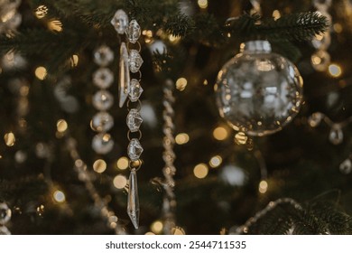 beautiful new year's toys, festive mood, selective focus, against the backdrop of bokeh from the lights of the garland. glass Christmas toys and glass icicles