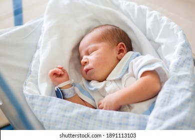 Beautiful newborn baby boy, laying in crib in prenatal hospital - Powered by Shutterstock