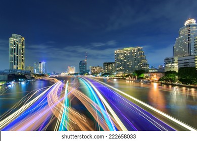 Beautiful night city bangkok with speed light on river