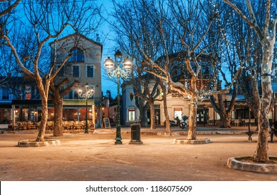 Beautiful night cityscape, tree illumination, lights and benches, central square Saint-Tropez, Provence, France - Powered by Shutterstock