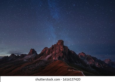 beautiful night panoramic mountain view of Dolomites Alps, Italy. starry sky and  milky way. natural background - Powered by Shutterstock