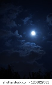 The Beautiful Night Sky With The Round Moon And Cloudy Sky