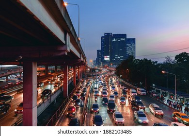 Beautiful night time image of traffic on road with moving cars lights, Bangkok Thailand.