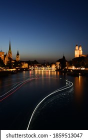 Beautiful Night View Of Fraumünster Church And St. Peter And River Limmat At Lake Zurich