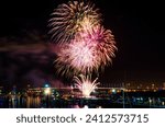 A beautiful night view of colorful fireworks during a holiday over Docklands, Melbourne, Australia