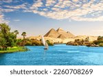 Beautiful Nile scenery  with sailboat in the Nile on the way to pyramids, Aswan, Egypt