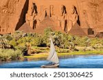 Beautiful Nile scenery with sailboat in the Nile on the way to The Front of the Abu Simbel Temple