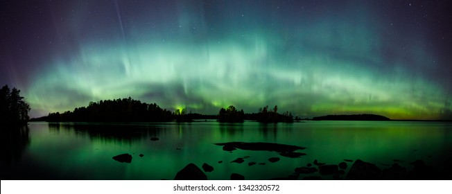 Beautiful Northern Lights Aurora Borealis Over Lake In Finland Panorama